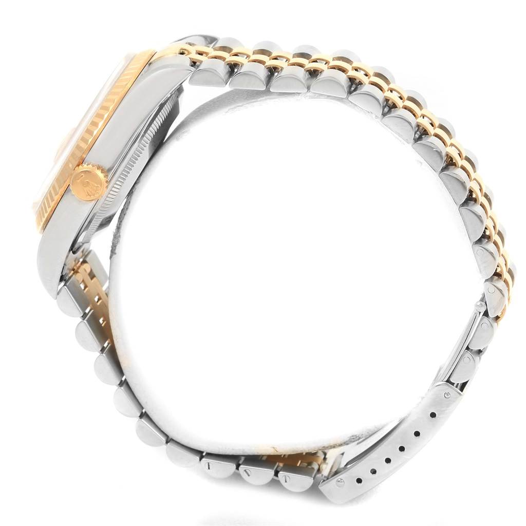 The image shows a side profile view of a Rolex Datejust 16233 Men's Steel and Gold (two tone) Champagne Dial 16233 Men's Steel and Gold (two tone) Champagne Dial watch, highlighting the crown, case, and bracelet.