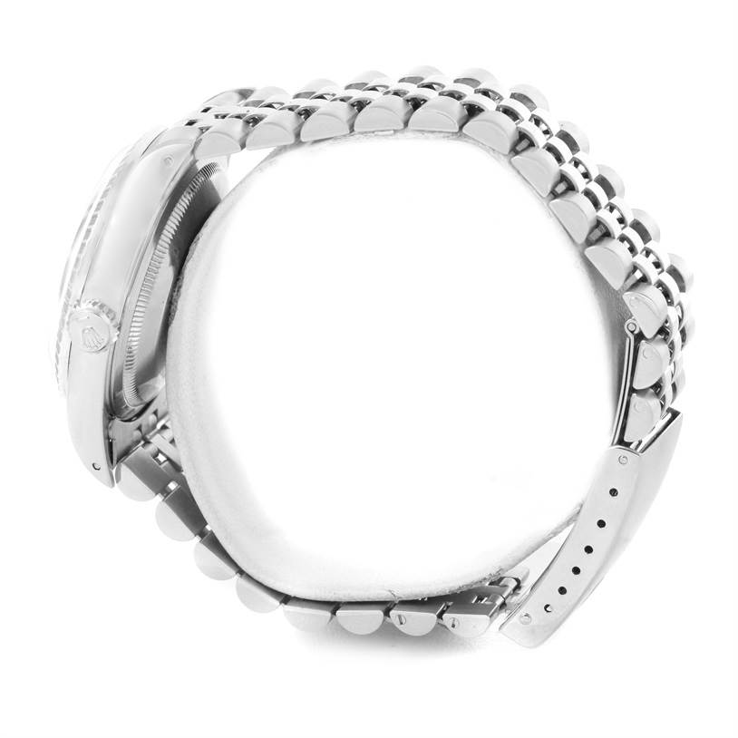 This image shows a side view of the Rolex Datejust 16220 Men's Stainless Steel Black Dial 16220 Men's Stainless Steel Black Dial watch, focusing on the case, crown, and metal bracelet.