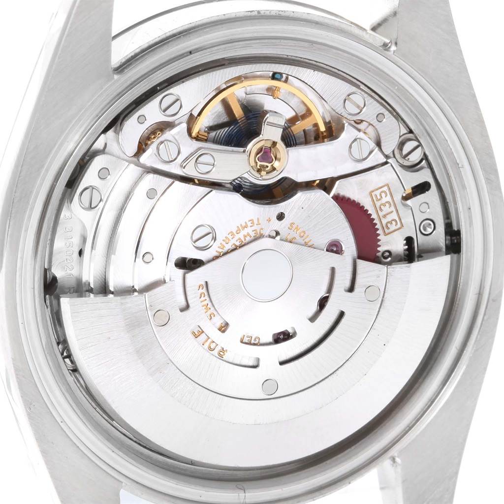 This image shows the inner mechanical workings and movement of a Rolex Datejust 116234 Men
s Stainless Steel Blue Dial 116234 Men
s Stainless Steel Blue Dial watch from a back view.