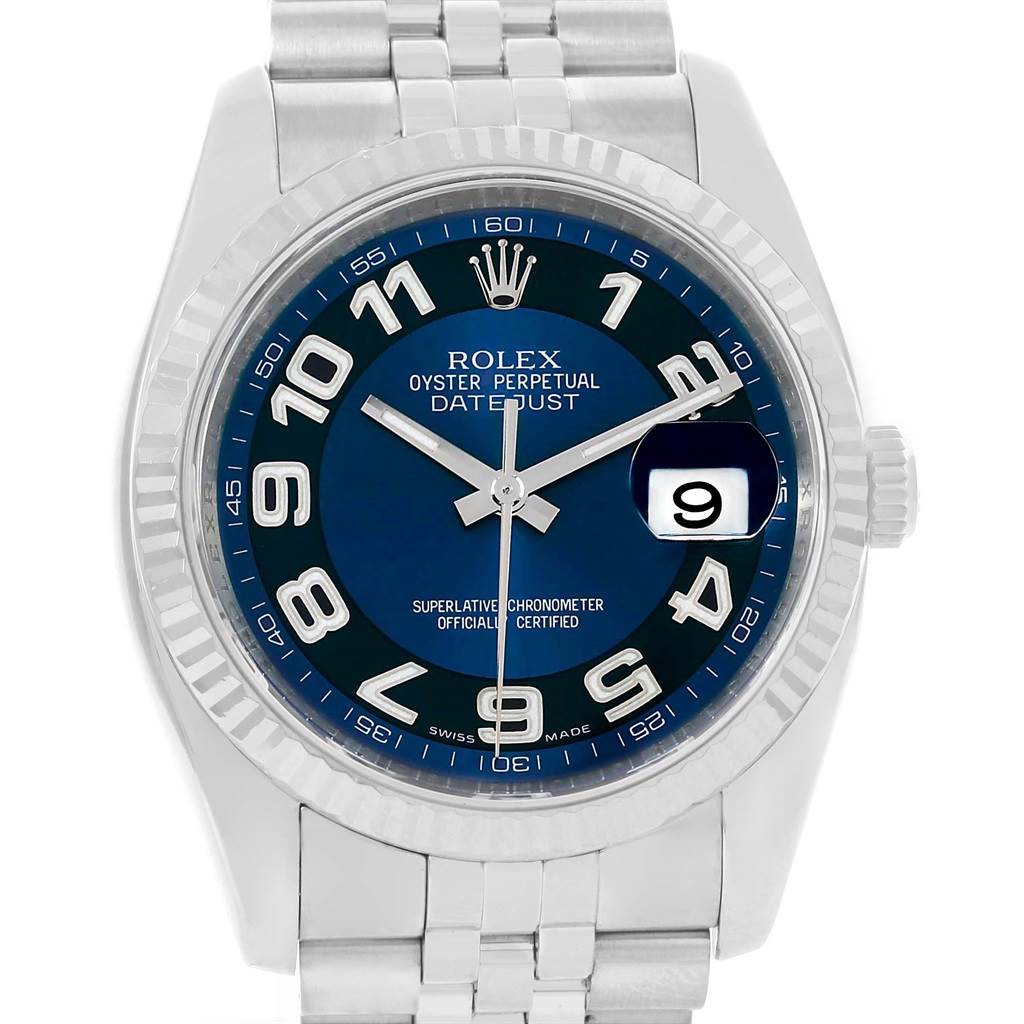 The image shows a front view of a Rolex Datejust 116234 Men
s Stainless Steel Blue Dial 116234 Men
s Stainless Steel Blue Dial watch highlighting its blue dial, numerals, and jubilee bracelet.