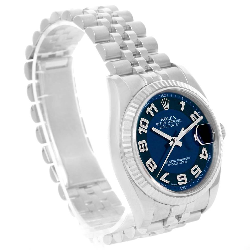 This Rolex Datejust 116234 Men
s Stainless Steel Blue Dial 116234 Men
s Stainless Steel Blue Dial watch is shown from an angled front view, highlighting its blue dial, bracelet, and fluted bezel.