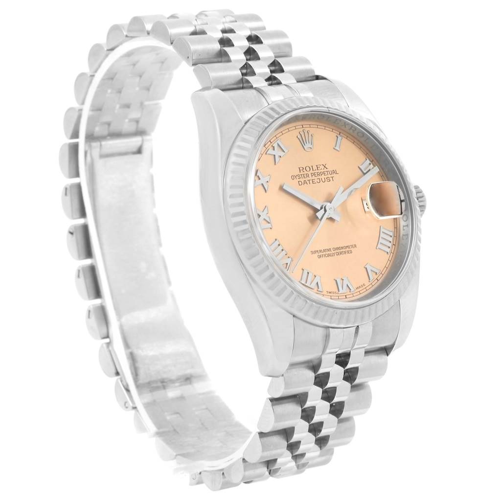 The image shows a Rolex Datejust 116234 Stainless Steel Pink Dial 116234 Stainless Steel Pink Dial watch from an angled side view, featuring its face, bezel, and bracelet.