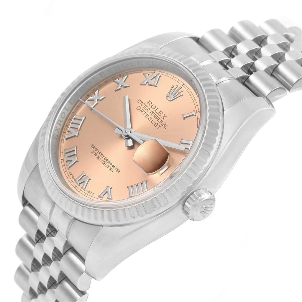 The image shows a close-up angle of the Rolex Datejust 116234 Stainless Steel Pink Dial 116234 Stainless Steel Pink Dial watch, highlighting its face, crown, and part of the bracelet.