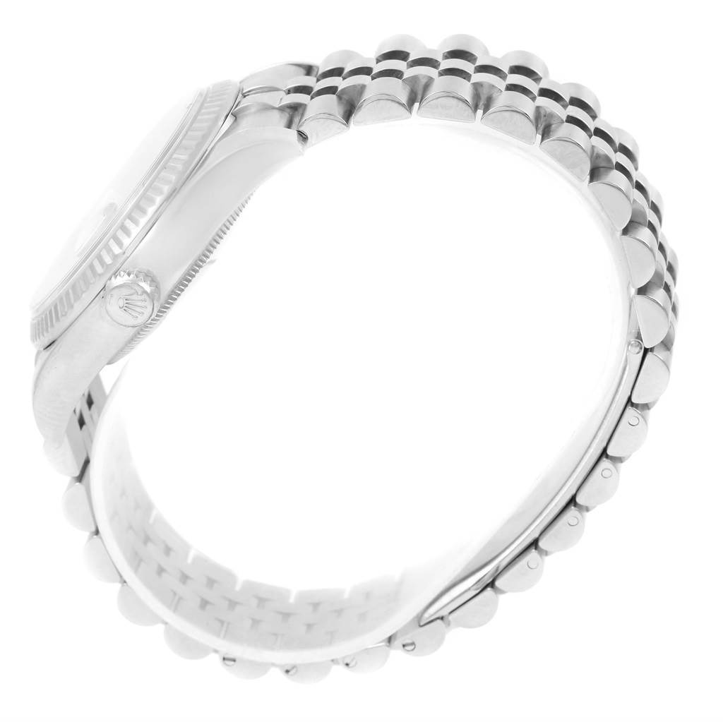 The image shows a side view of the Rolex Datejust 116234 Stainless Steel Pink Dial 116234 Stainless Steel Pink Dial watch, highlighting the bezel, crown, and Jubilee bracelet.