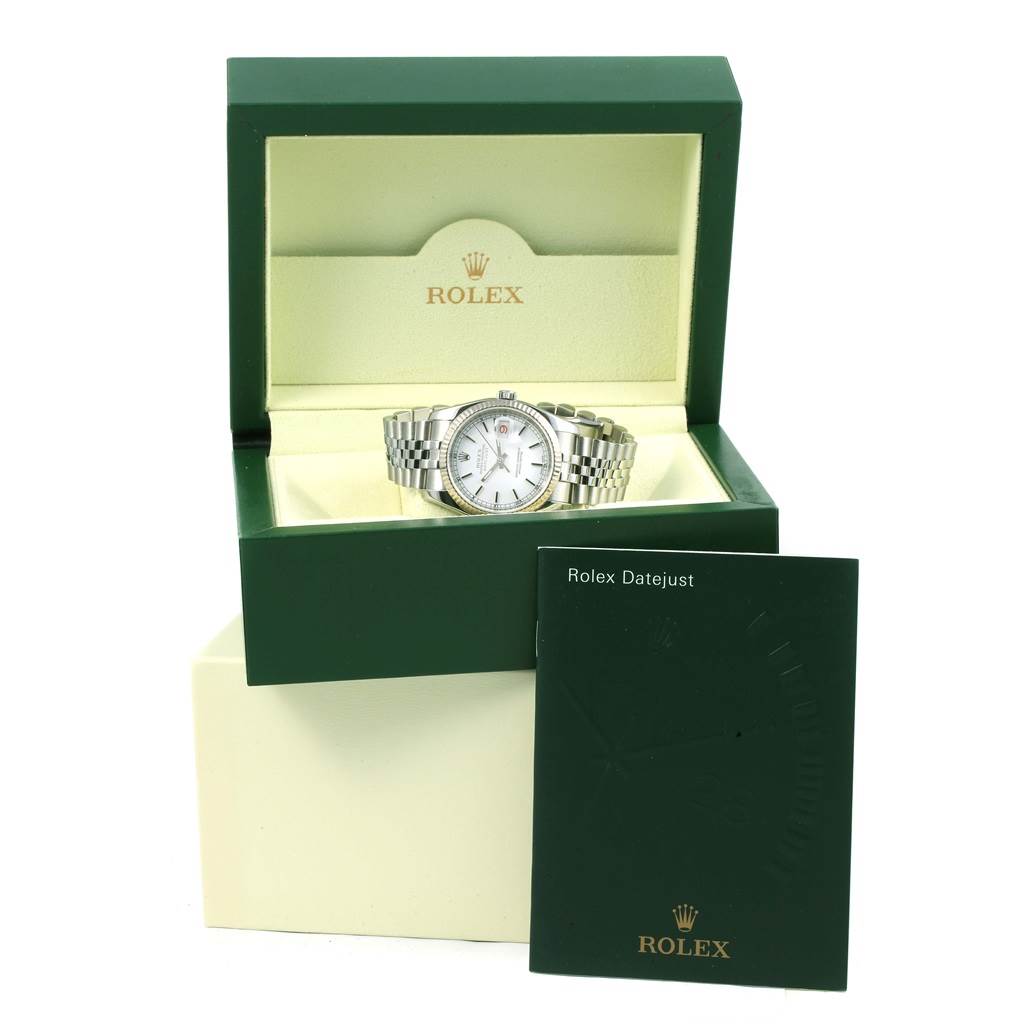 The image shows a Rolex Datejust 116234 Men's Stainless Steel White Dial 116234 Men's Stainless Steel White Dial watch inside its green box with a booklet propped up against the box.