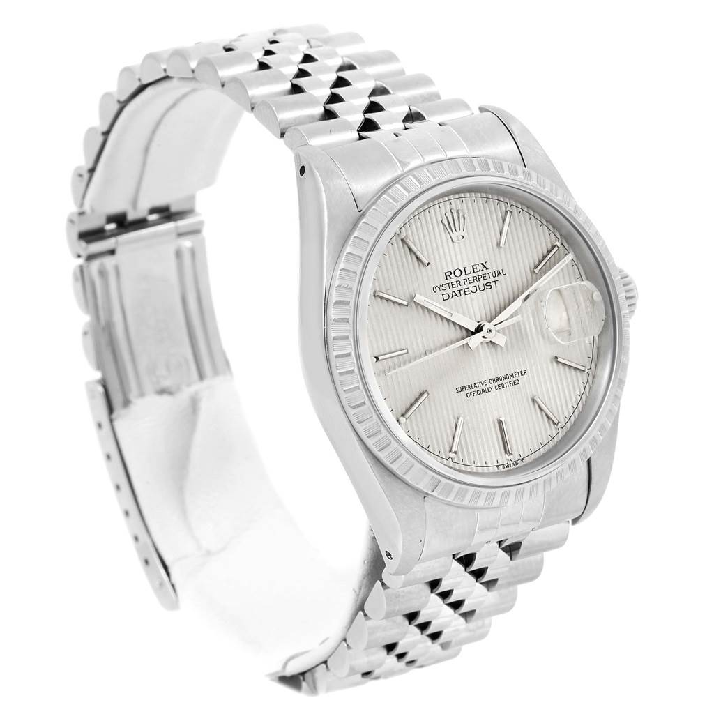 The image shows a side angle of the Rolex Datejust 16220 Men's Stainless Steel Silver Dial 16220 Men's Stainless Steel Silver Dial watch, highlighting the face, bezel, and Jubilee bracelet.