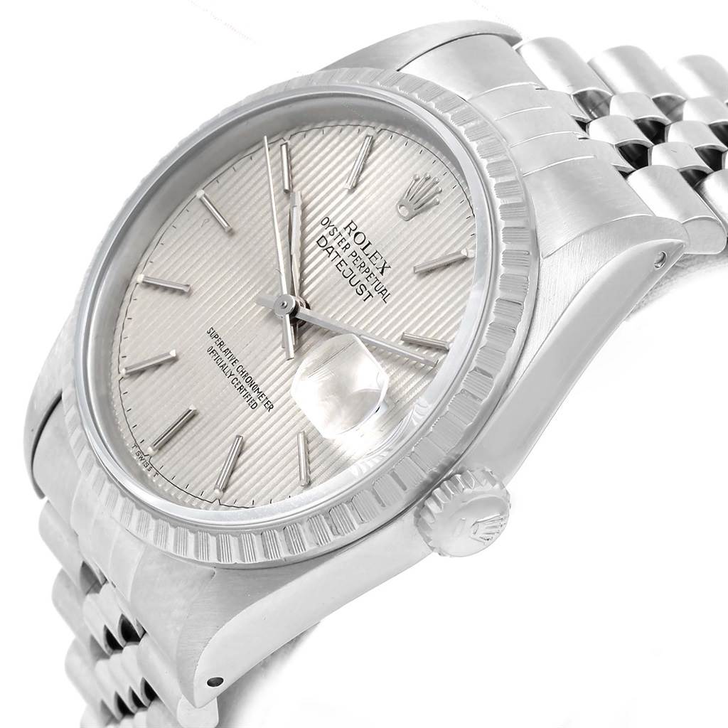 The image shows a Rolex Datejust 16220 Men's Stainless Steel Silver Dial 16220 Men's Stainless Steel Silver Dial watch at an angled close-up, highlighting its dial, bezel, and part of the bracelet. 