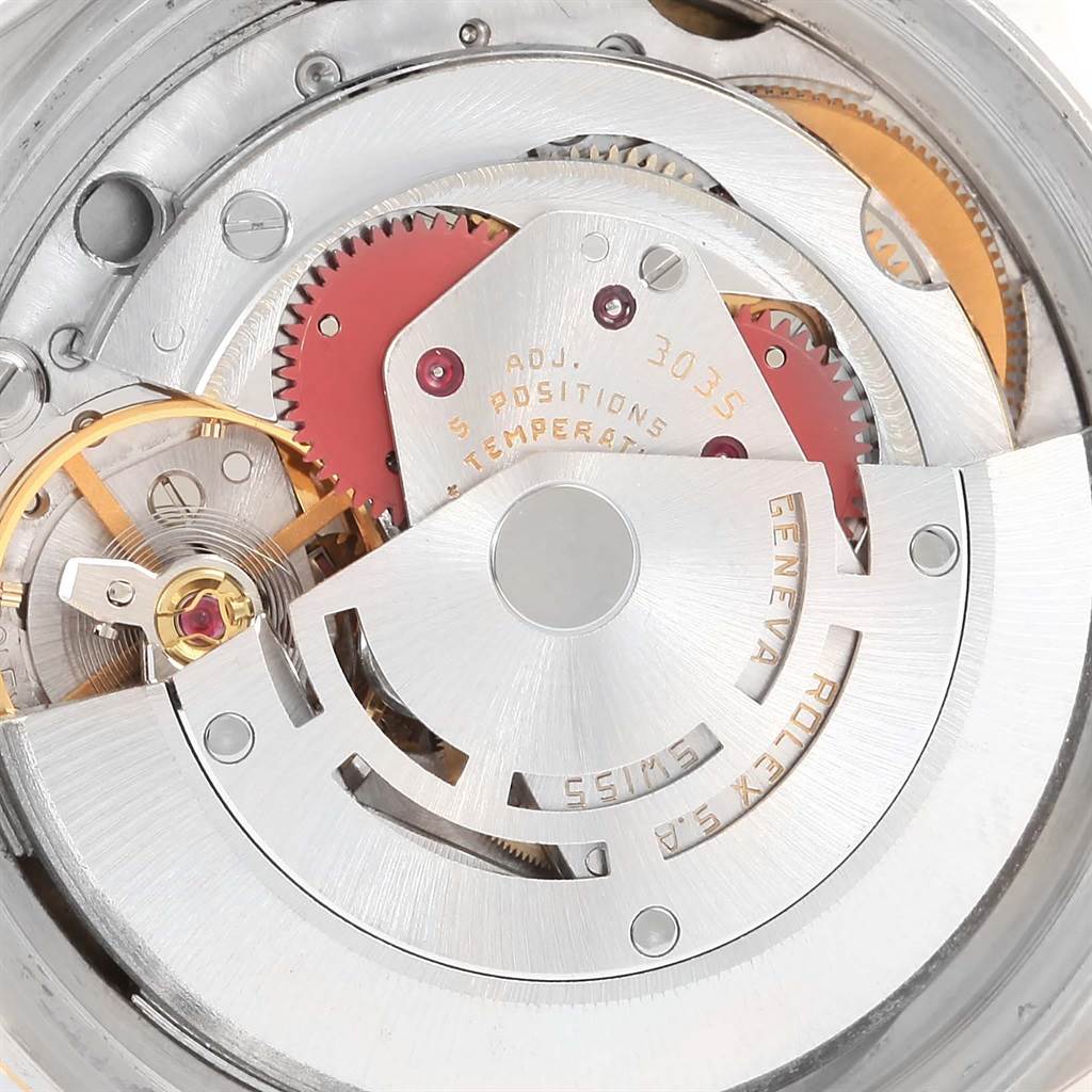 This is an internal view of the Rolex Datejust 16013 Men's Stainless Steel Champagne Dial 16013 Men's Stainless Steel Champagne Dial watch, showing the intricate components of its movement mechanism.