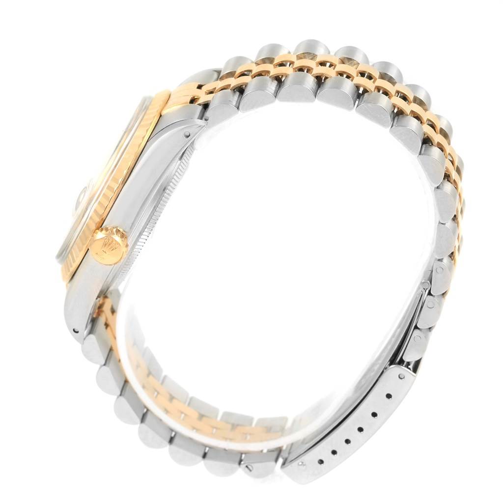 This image shows a side profile of the Rolex Datejust 16013 Men's Stainless Steel Champagne Dial 16013 Men's Stainless Steel Champagne Dial watch, highlighting the two-tone bracelet and case.