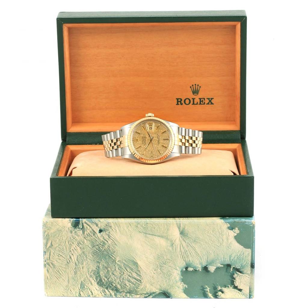 The Rolex Datejust 16013 Men's Stainless Steel Champagne Dial 16013 Men's Stainless Steel Champagne Dial watch is displayed front-on inside an open green and wood-colored box.