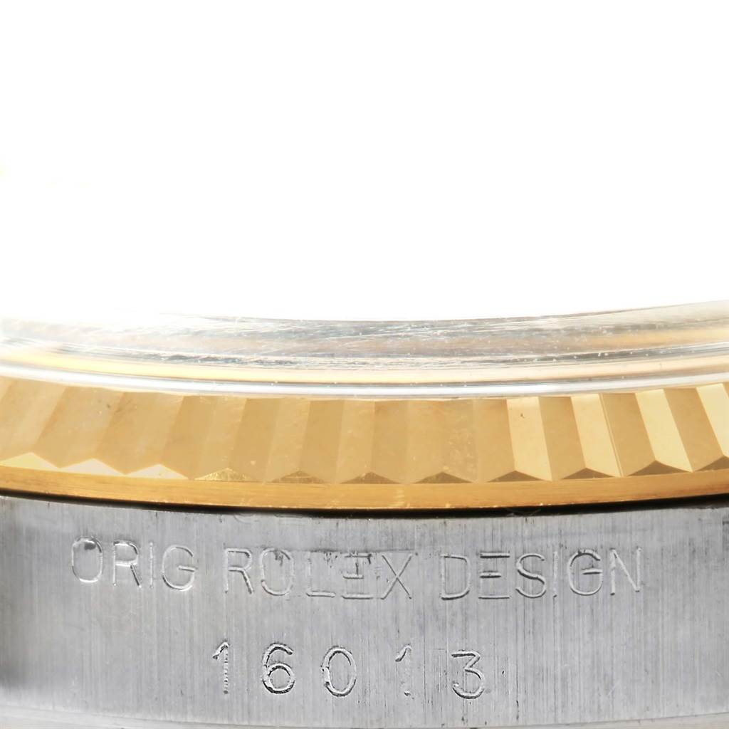 The close-up image shows the side of a Rolex Datejust 16013 Men's Stainless Steel Champagne Dial 16013 Men's Stainless Steel Champagne Dial watch case, bezel, and model number engraving (16013).