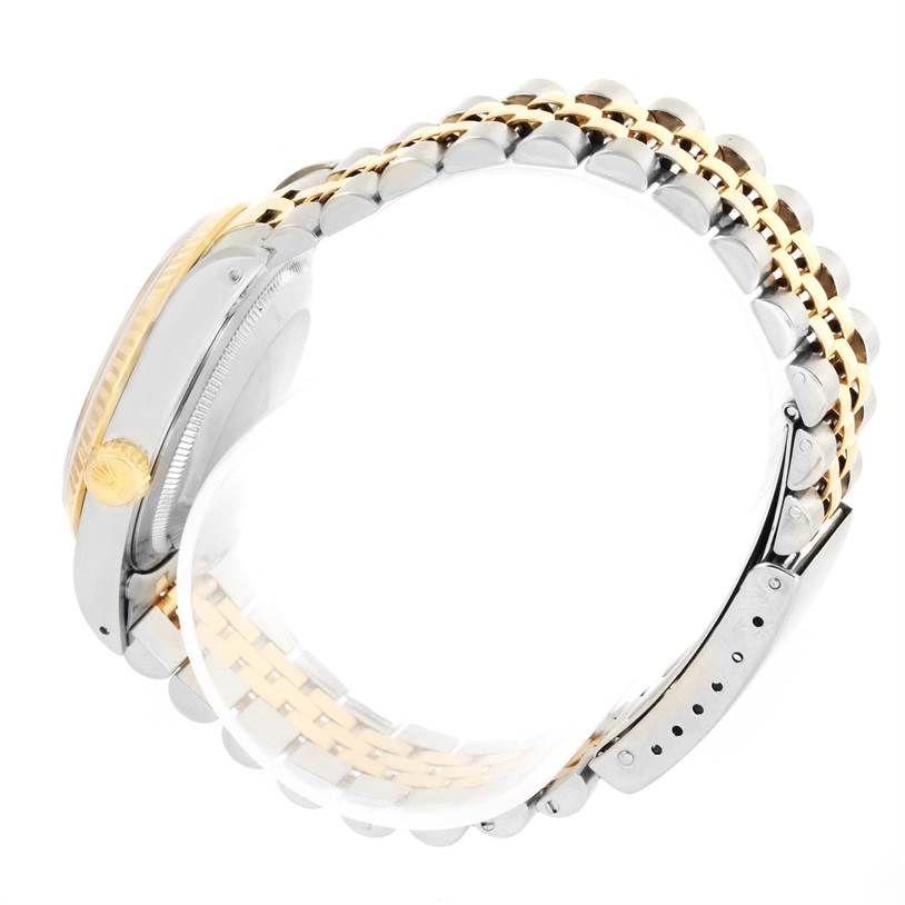 The image shows a Rolex Datejust 16233 Men's Steel and Gold (two tone) Champagne Dial 16233 Men's Steel and Gold (two tone) Champagne Dial watch from a side angle, highlighting the crown, case, and Jubilee bracelet.