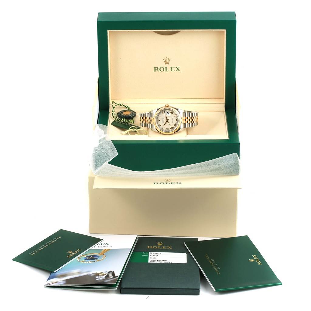 This image shows a Rolex Datejust 116233 Men's Stainless Steel Beige Dial 116233 Men's Stainless Steel Beige Dial watch in its open box with accompanying booklets and accessories.