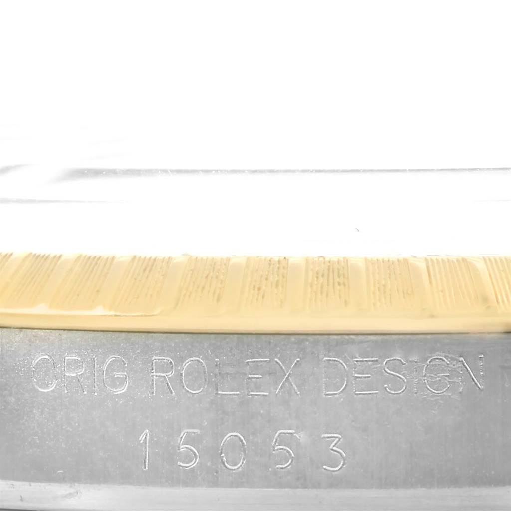 This image shows a close-up view of the model number and the fluted bezel on a Rolex Datejust 15053 Men's Steel and Gold (two tone) Blue Dial 15053 Men's Steel and Gold (two tone) Blue Dial watch.