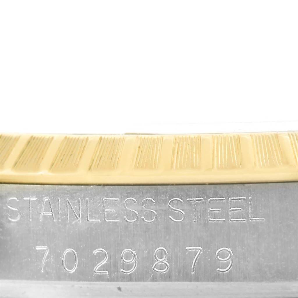This close-up shows the model number and the "STAINLESS STEEL" engraving on a Rolex Datejust 15053 Men's Steel and Gold (two tone) Blue Dial 15053 Men's Steel and Gold (two tone) Blue Dial watch.