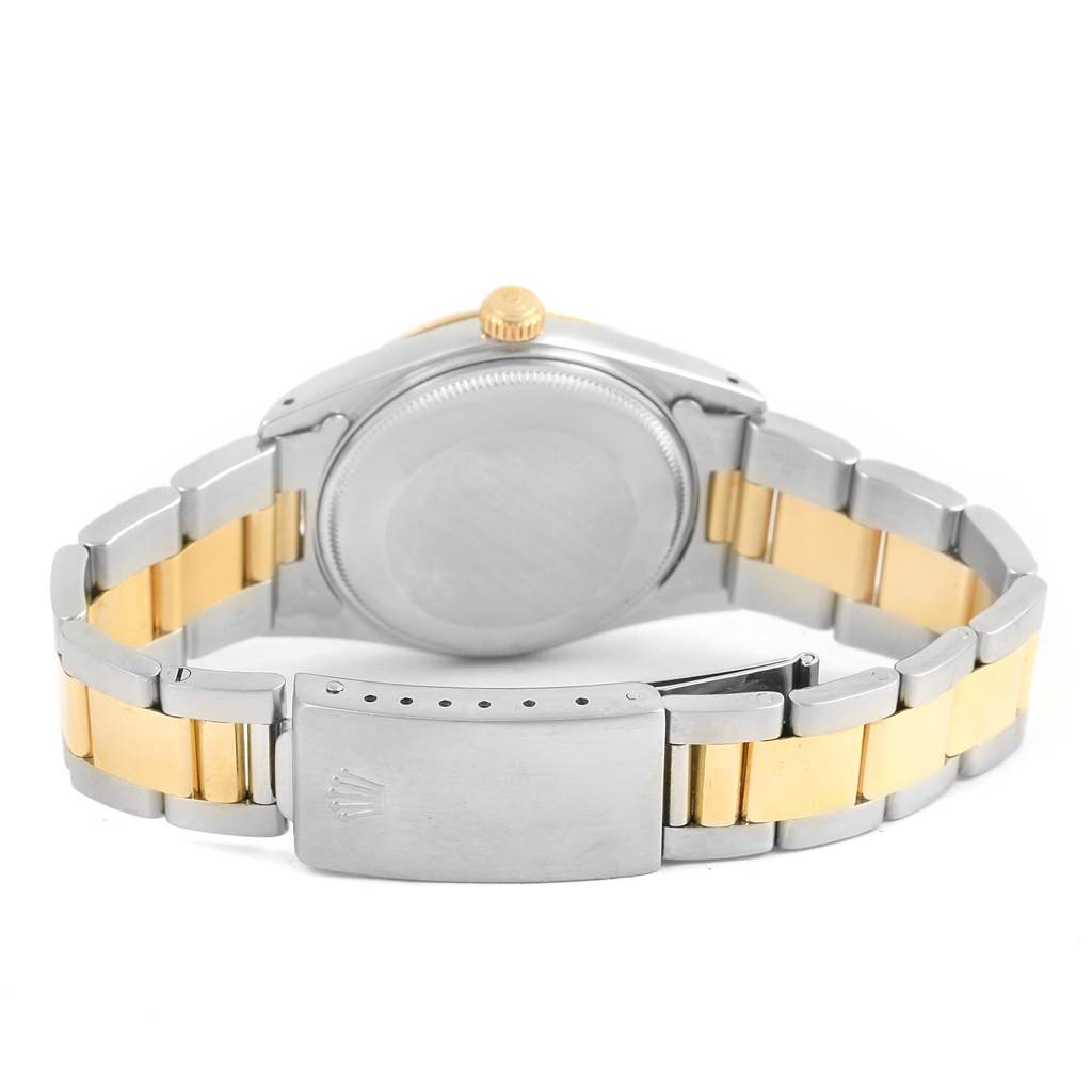 The Rolex Datejust 15053 Men's Steel and Gold (two tone) Blue Dial 15053 Men's Steel and Gold (two tone) Blue Dial watch is shown from the back, highlighting the case, bezel, crown, and two-tone bracelet with the clasp.