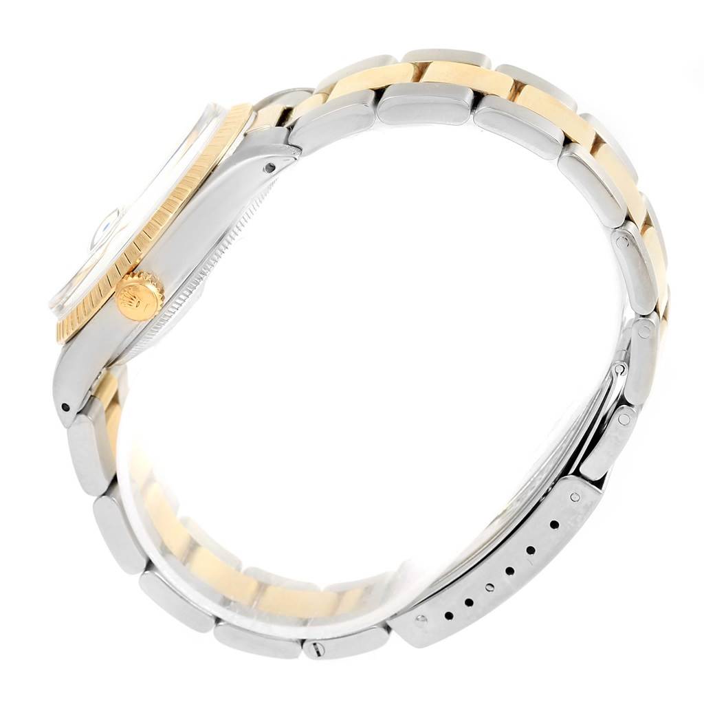 The image shows a side view of a Rolex Datejust 15053 Men's Steel and Gold (two tone) Blue Dial 15053 Men's Steel and Gold (two tone) Blue Dial watch, highlighting its two-tone bracelet, crown, and case.