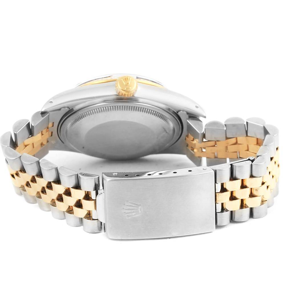 This image shows the back view of a Rolex Datejust 16013 Men's Stainless Steel Champagne Dial 16013 Men's Stainless Steel Champagne Dial watch, highlighting the clasp, case back, and two-toned bracelet.