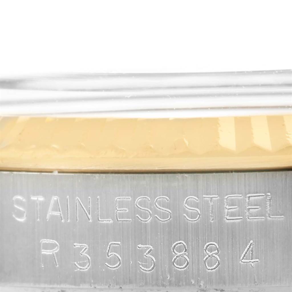 The image shows a close-up of the serial number and the "STAINLESS STEEL" engraving on the Rolex Datejust 16013 Men's Stainless Steel Champagne Dial 16013 Men's Stainless Steel Champagne Dial model.