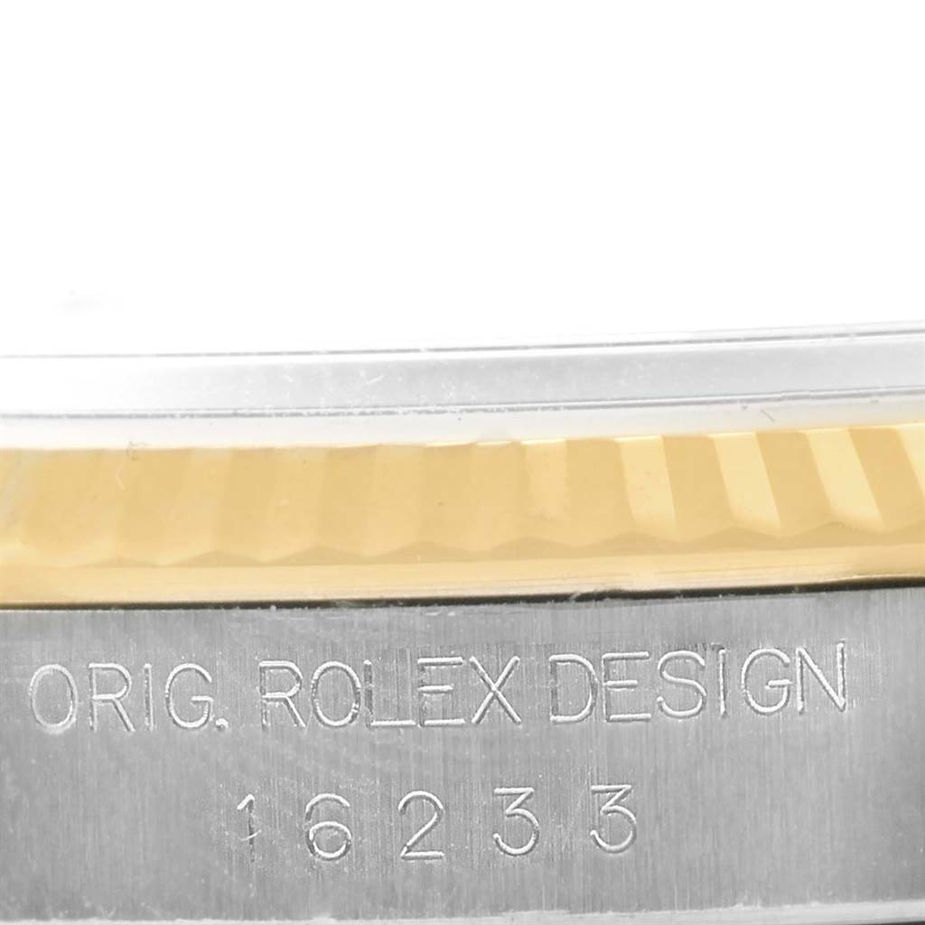 This image shows a close-up of the model and design engraving on the side of a Rolex Datejust 16233 Men's Steel and Gold (two tone) Champagne Dial 16233 Men's Steel and Gold (two tone) Champagne Dial watch.