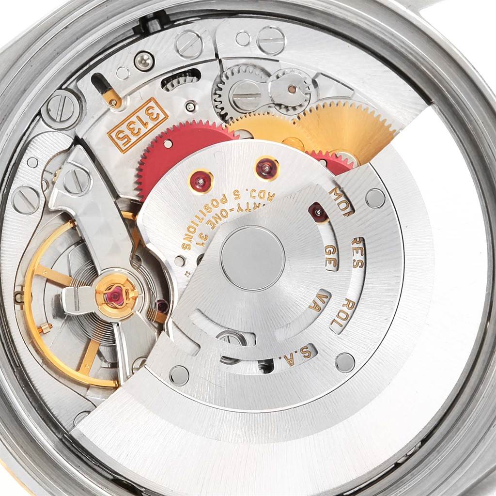 The image shows the inner mechanical movement and components of a Rolex Datejust 16233 Men's Steel and Gold (two tone) Champagne Dial 16233 Men's Steel and Gold (two tone) Champagne Dial watch.