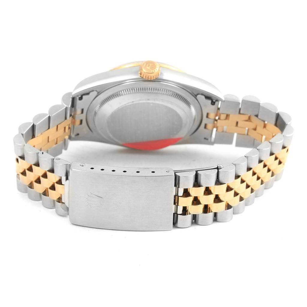 The image shows the back of a Rolex Datejust 16233 Men's Steel and Gold (two tone) Champagne Dial 16233 Men's Steel and Gold (two tone) Champagne Dial watch, including its case back and two-tone bracelet with the clasp.