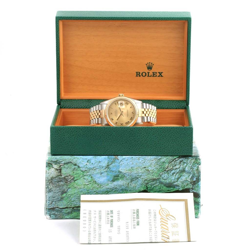 The image shows a Rolex Datejust 16233 Men's Steel and Gold (two tone) Champagne Dial 16233 Men's Steel and Gold (two tone) Champagne Dial watch in its open box from a front angle, with paperwork in the foreground.