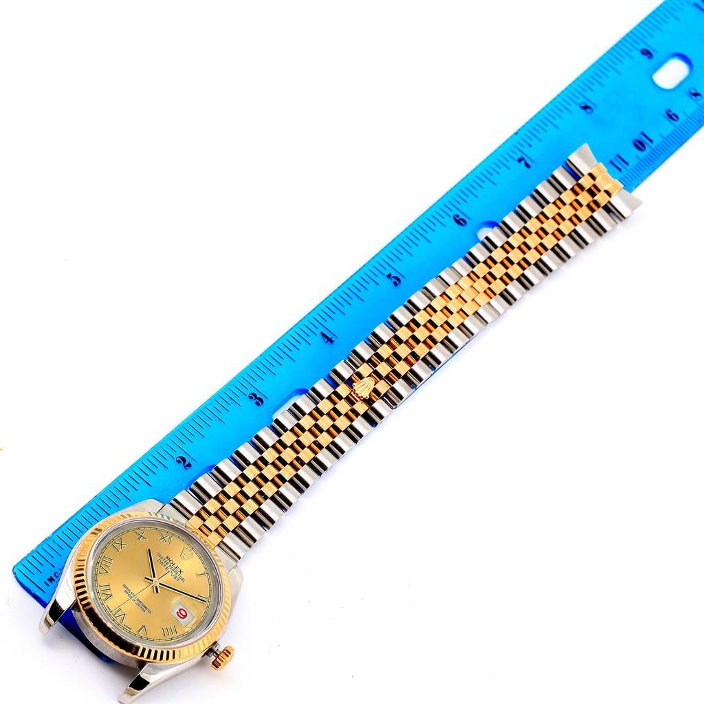 The image shows a top-down view of a Rolex Datejust 116233 Men's Stainless Steel Champagne Dial 116233 Men's Stainless Steel Champagne Dial, highlighting the face, crown, and bracelet length with a ruler for scale.