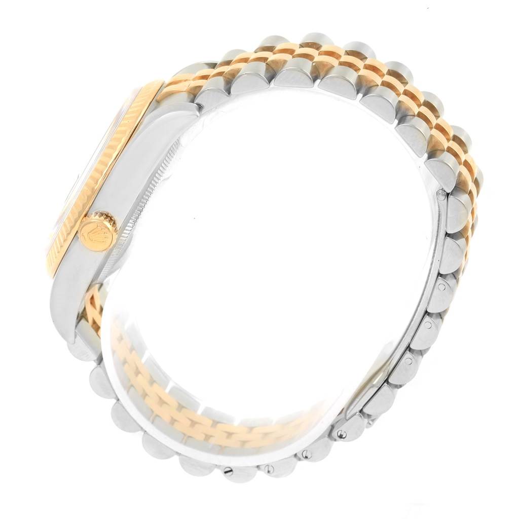 This image shows the side view of a Rolex Datejust 116233 Men's Stainless Steel Champagne Dial 116233 Men's Stainless Steel Champagne Dial watch, highlighting the crown and the two-tone bracelet.