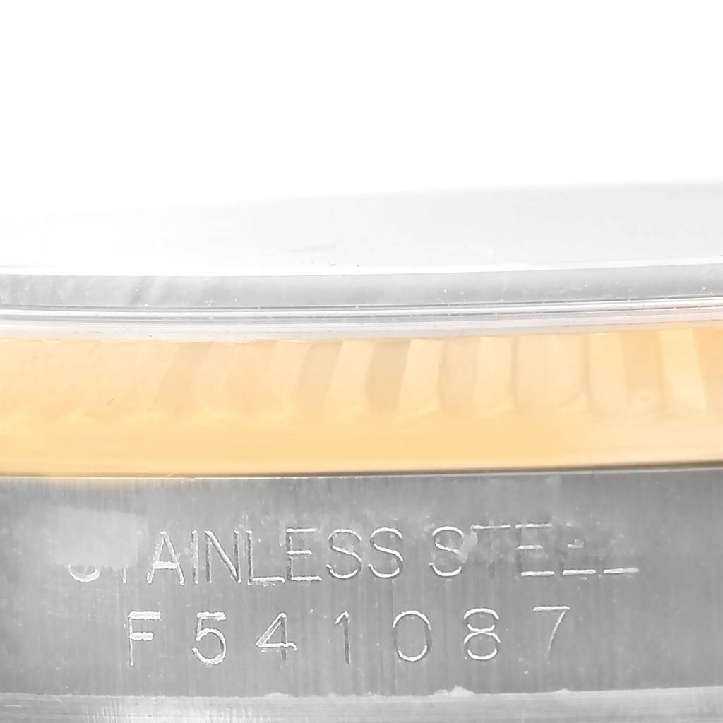 The image shows a close-up of the serial number engraved on the case side of a Rolex Datejust 116233 Men's Stainless Steel Champagne Dial 116233 Men's Stainless Steel Champagne Dial.