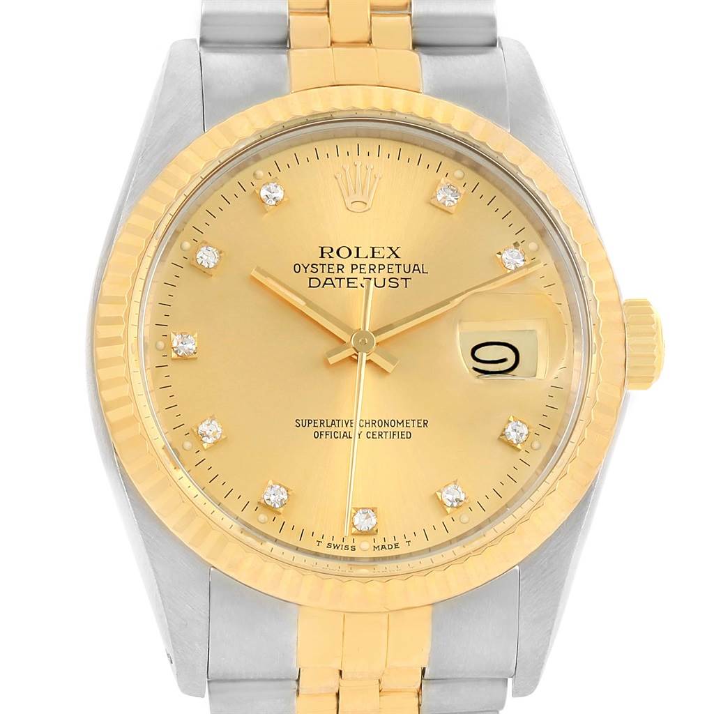 This image shows a close-up, front view of the dial and bracelet of a Rolex Datejust 16013 Men's Stainless Steel Champagne Dial 16013 Men's Stainless Steel Champagne Dial watch.