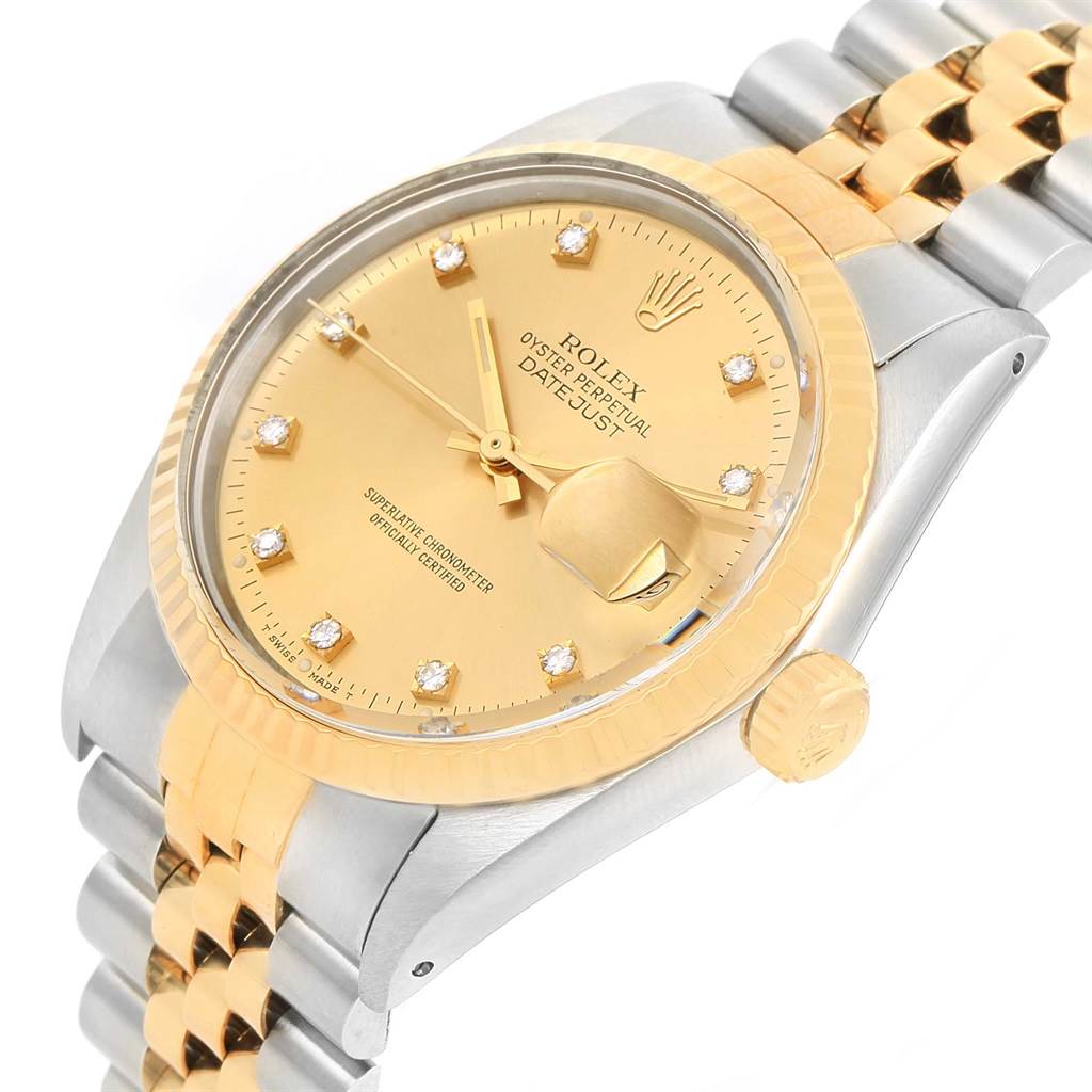 This image shows a close-up angle of a Rolex Datejust 16013 Men's Stainless Steel Champagne Dial 16013 Men's Stainless Steel Champagne Dial watch, highlighting its gold dial, fluted bezel, and Jubilee bracelet.