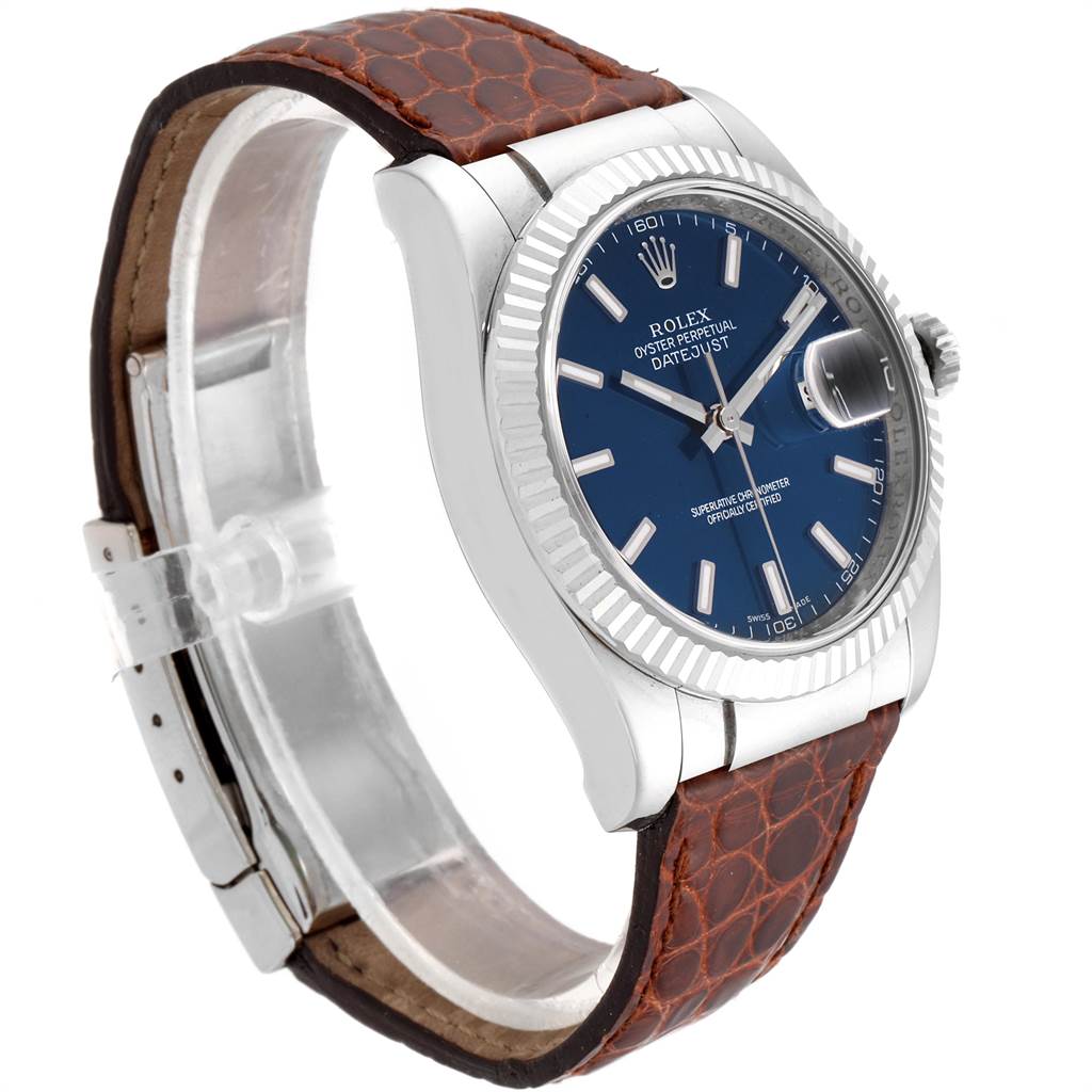 The Rolex Datejust 116139 Men's White Gold Blue Dial 116139 Men's White Gold Blue Dial watch is shown at a three-quarter angle, highlighting its blue dial, bezel, and leather strap.