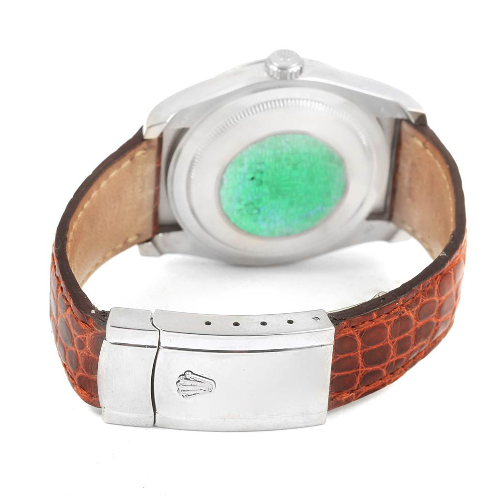 The image shows the case back and clasp of a Rolex Datejust 116139 Men's White Gold Blue Dial 116139 Men's White Gold Blue Dial watch, featuring a brown leather strap.