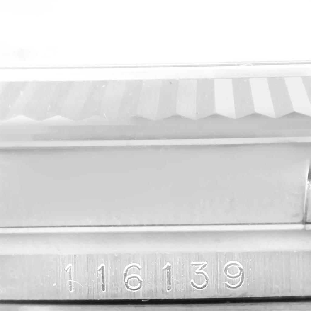 This image shows a close-up of the side of a Rolex Datejust 116139 Men's White Gold Blue Dial 116139 Men's White Gold Blue Dial watch, focusing on the bezel and a part of the case with the model number 116139.