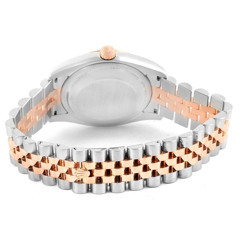 This image shows the back and part of the bracelet of a Rolex Datejust 116231 Men's Steel and Gold (two tone) Black Dial 116231 Men's Steel and Gold (two tone) Black Dial watch, featuring a two-tone metallic band.