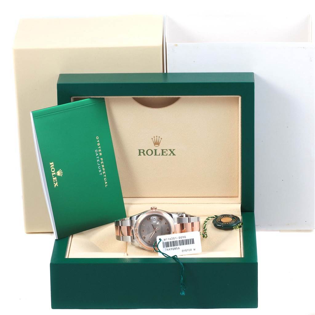 The image shows a Rolex Datejust 116201 Steel and Gold (two tone) Grey Dial 116201 Steel and Gold (two tone) Grey Dial watch in its open box, with a green booklet and a tag next to it.