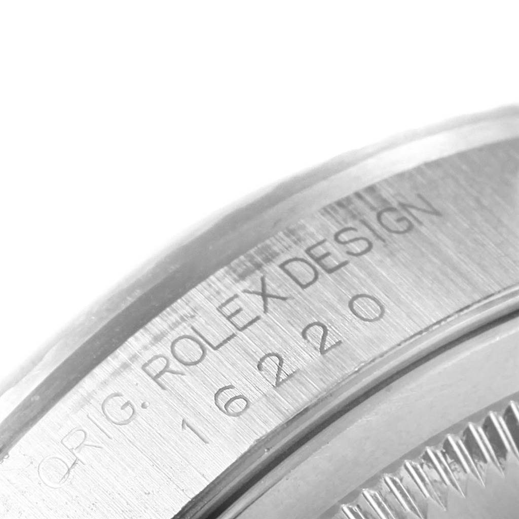 The image shows a close-up of the case side and engraving on a Rolex Datejust 16220 Men's Stainless Steel Black Dial 16220 Men's Stainless Steel Black Dial watch.