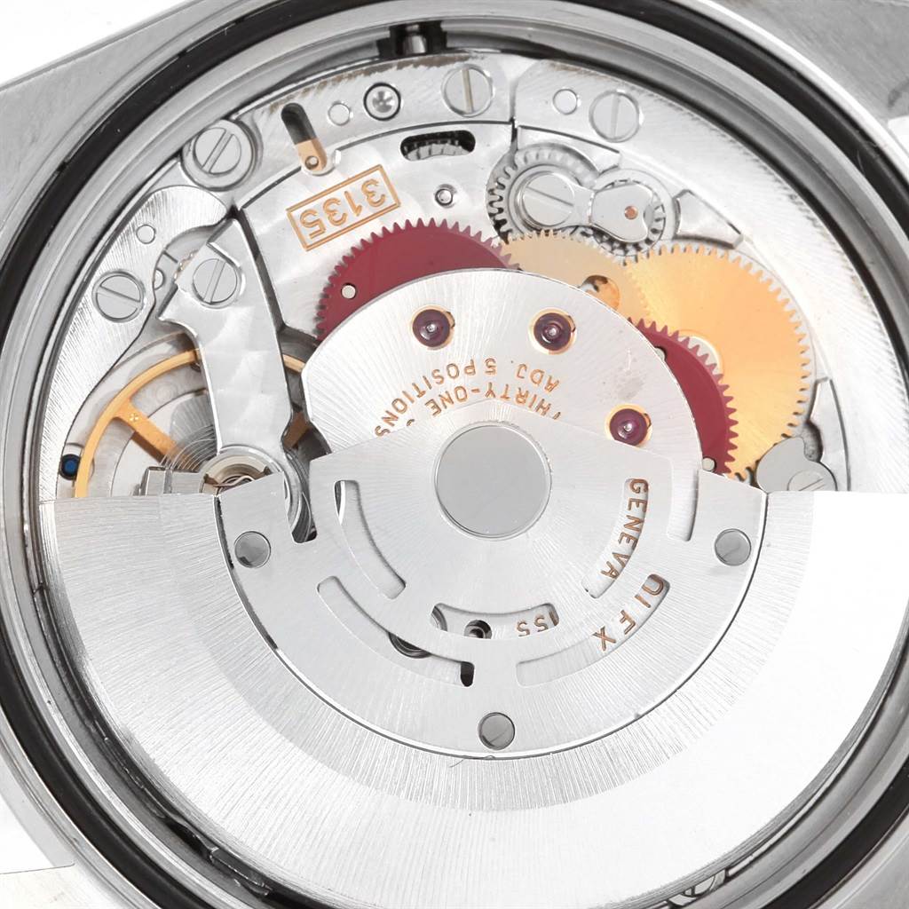 The image shows a close-up view of the movement mechanism of a Rolex Datejust 16220 Men's Stainless Steel Black Dial 16220 Men's Stainless Steel Black Dial watch.