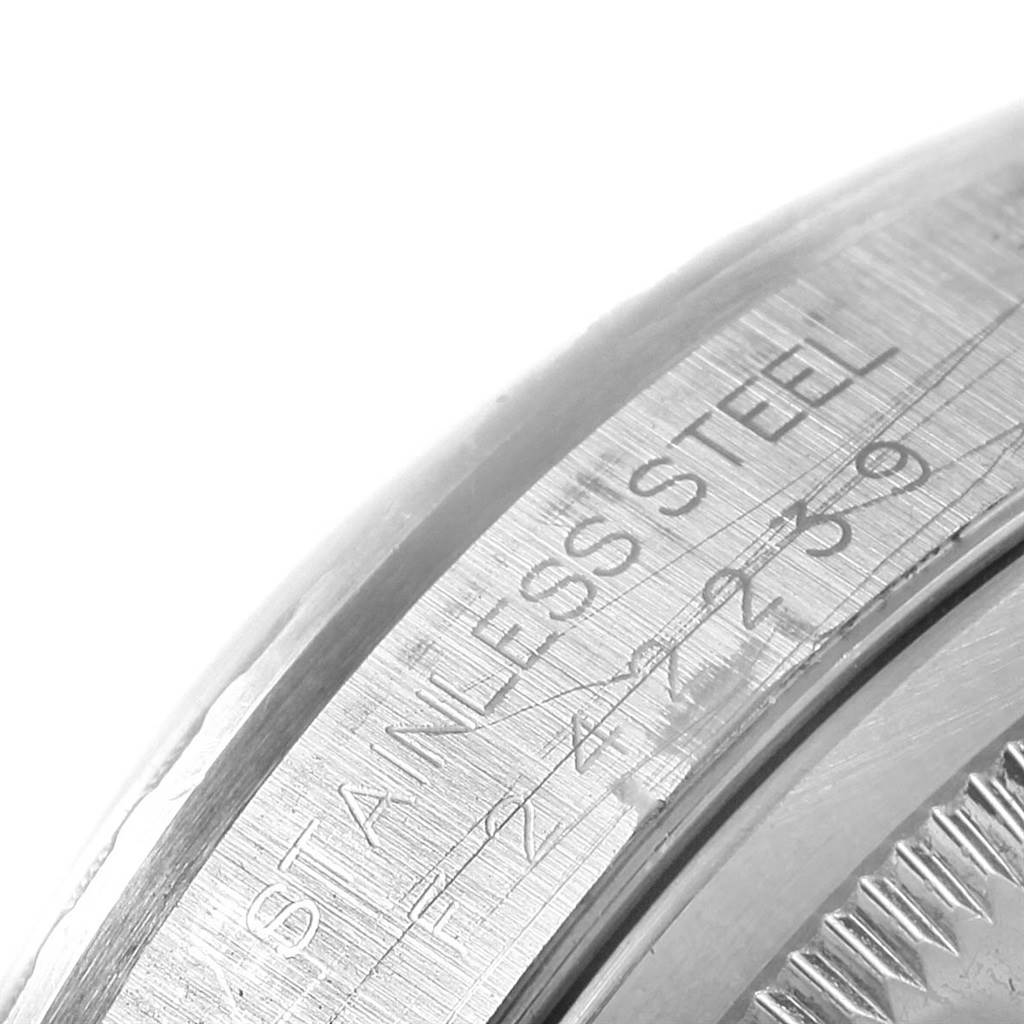 The image shows a close-up of the stainless steel case back edge with engravings on a Rolex Datejust 16220 Men's Stainless Steel Black Dial 16220 Men's Stainless Steel Black Dial watch.