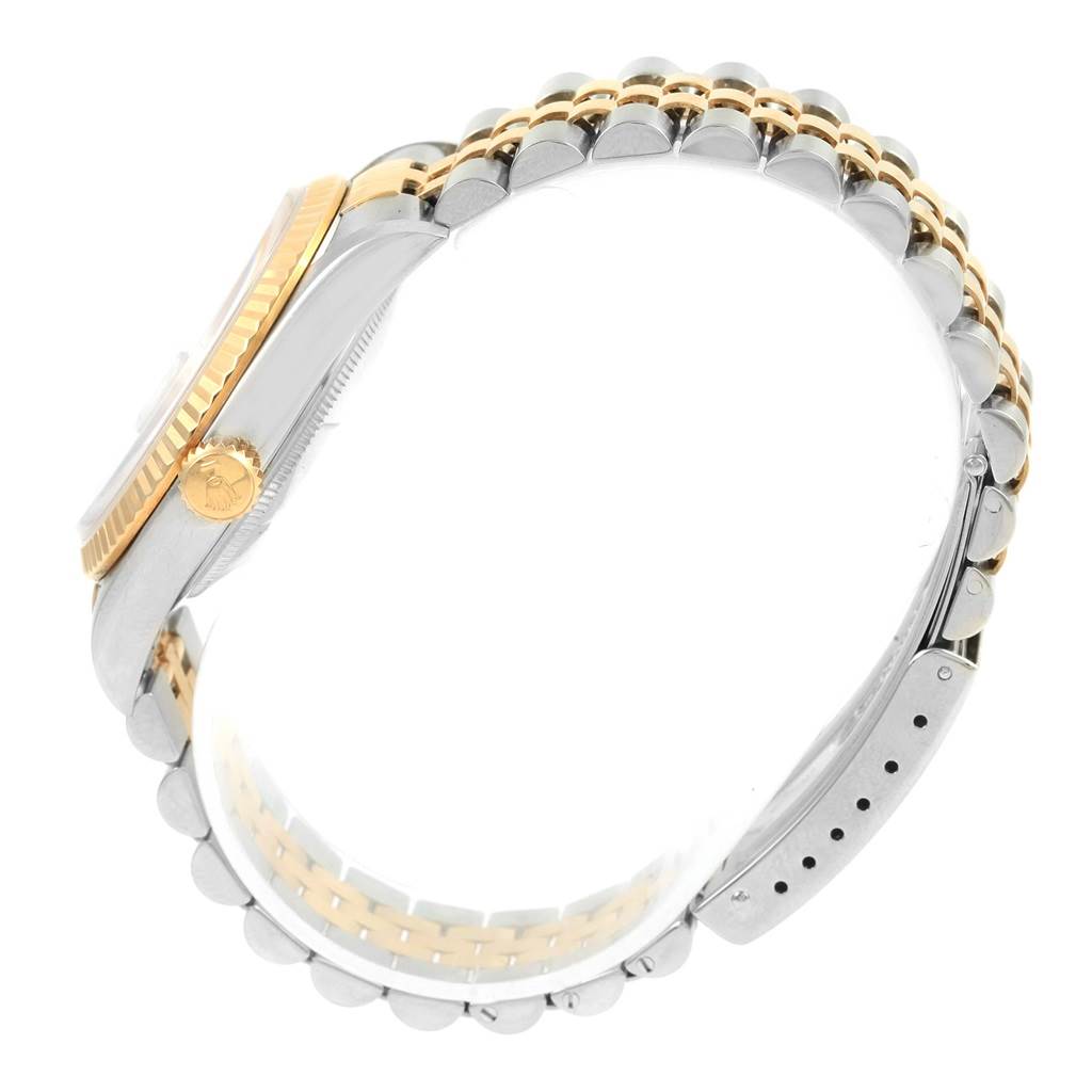 The image shows a side view of the Rolex Datejust 16233 Men's Steel and Gold (two tone) Beige Dial 16233 Men's Steel and Gold (two tone) Beige Dial watch, highlighting the two-tone case, bezel, crown, and Jubilee bracelet.