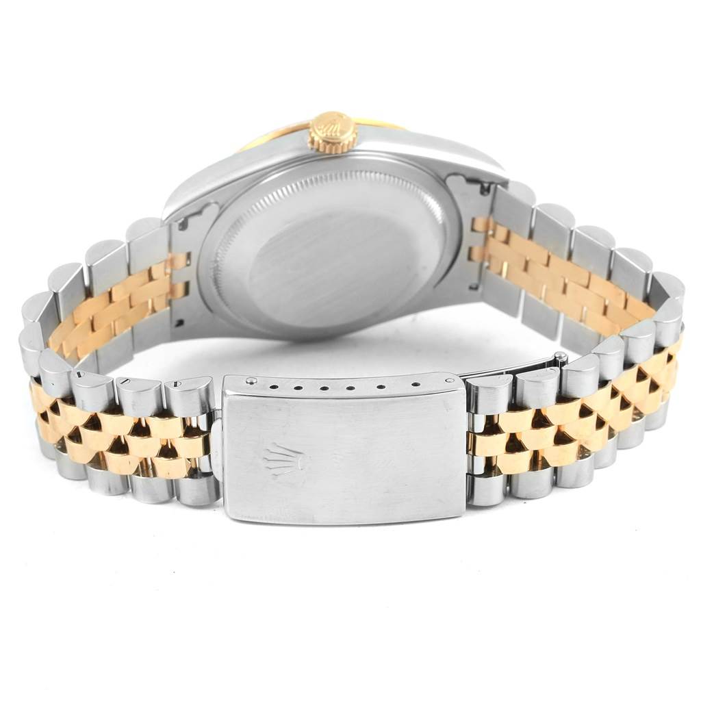 The image shows the back view of a Rolex Datejust 16233 Men's Steel and Gold (two tone) Beige Dial 16233 Men's Steel and Gold (two tone) Beige Dial watch, highlighting its two-tone bracelet and clasp.