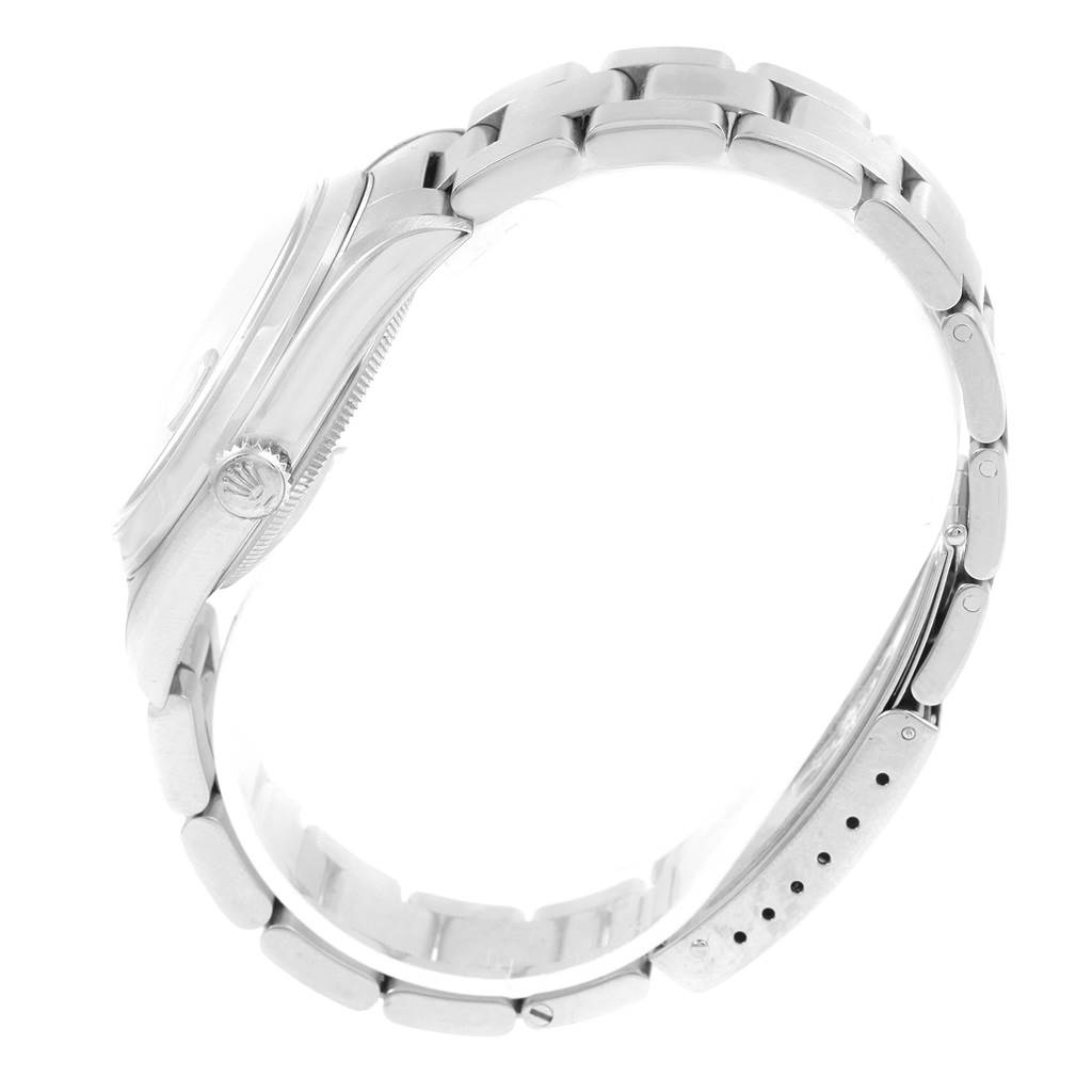 The image shows a side view of the Rolex Datejust 16200 Men's Stainless Steel Black Dial 16200 Men's Stainless Steel Black Dial watch, highlighting its bracelet and the crown.