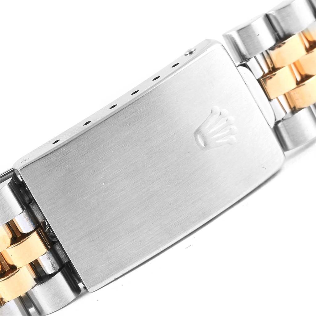 The image shows a close-up of the clasp with the Rolex crown logo and part of the two-tone bracelet of a Rolex Datejust 16233 Men's Steel and Gold (two tone) Champagne Dial 16233 Men's Steel and Gold (two tone) Champagne Dial watch.