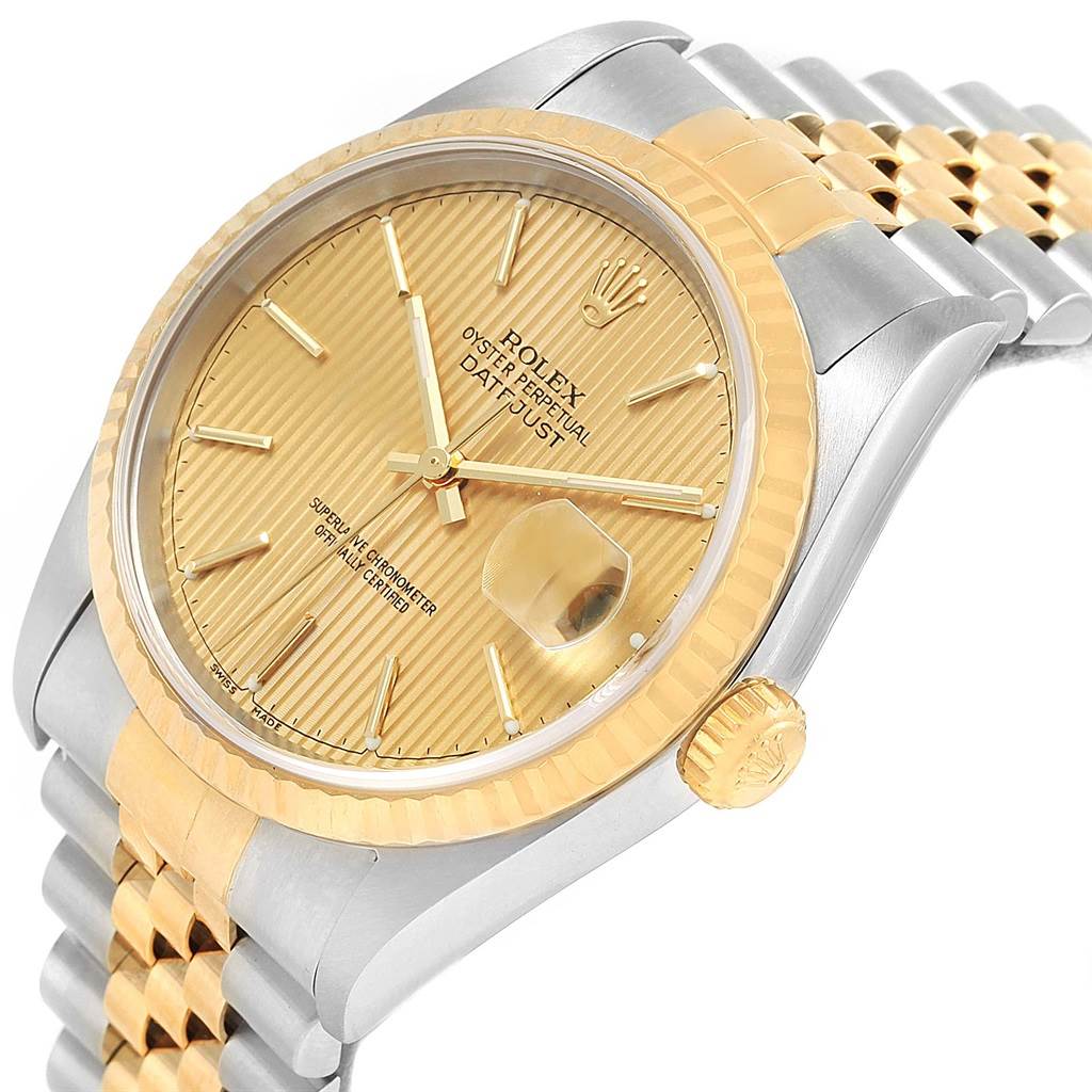 This image shows a close-up angle of the Rolex Datejust 16233 Men's Steel and Gold (two tone) Champagne Dial 16233 Men's Steel and Gold (two tone) Champagne Dial watch, displaying its dial, bezel, crown, and part of the bracelet.
