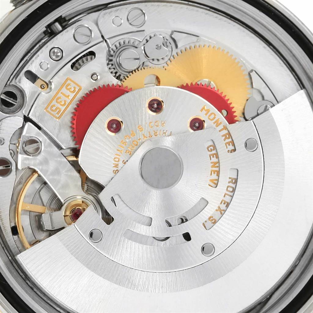 The image shows an internal view of the mechanical movement of a Rolex Datejust 16233 Men's Steel and Gold (two tone) Champagne Dial 16233 Men's Steel and Gold (two tone) Champagne Dial watch, highlighting gears and rotor.