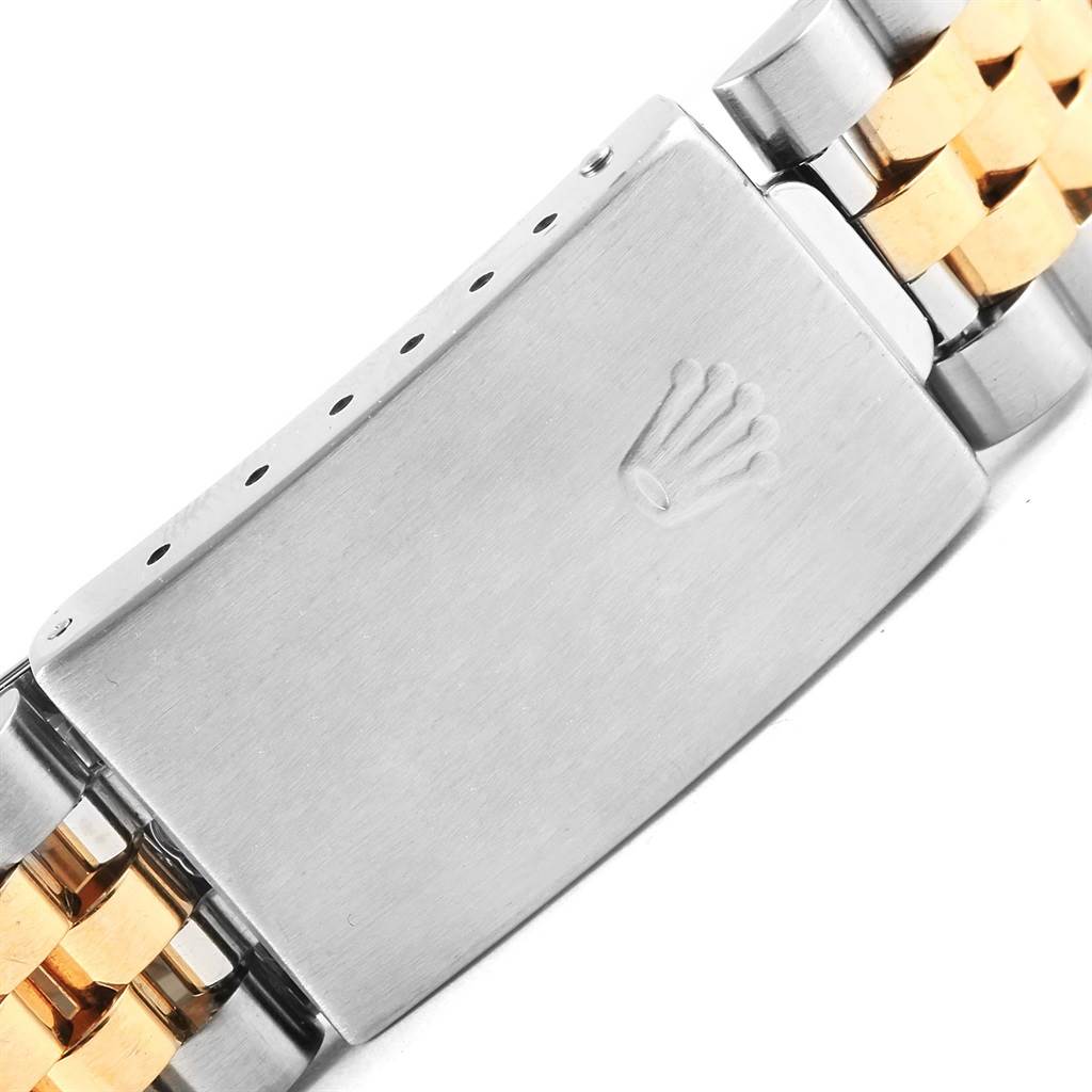 This image shows a close-up of the clasp and part of the bracelet of a Rolex Datejust 16233 Men's Steel and Gold (two tone) Champagne Dial 16233 Men's Steel and Gold (two tone) Champagne Dial watch.
