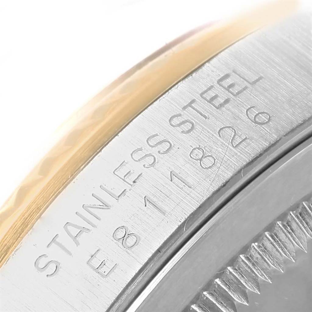 The image shows a close-up of the side of a Rolex Datejust 16233 Men's Steel and Gold (two tone) Champagne Dial 16233 Men's Steel and Gold (two tone) Champagne Dial watch, highlighting the stainless steel engraving.