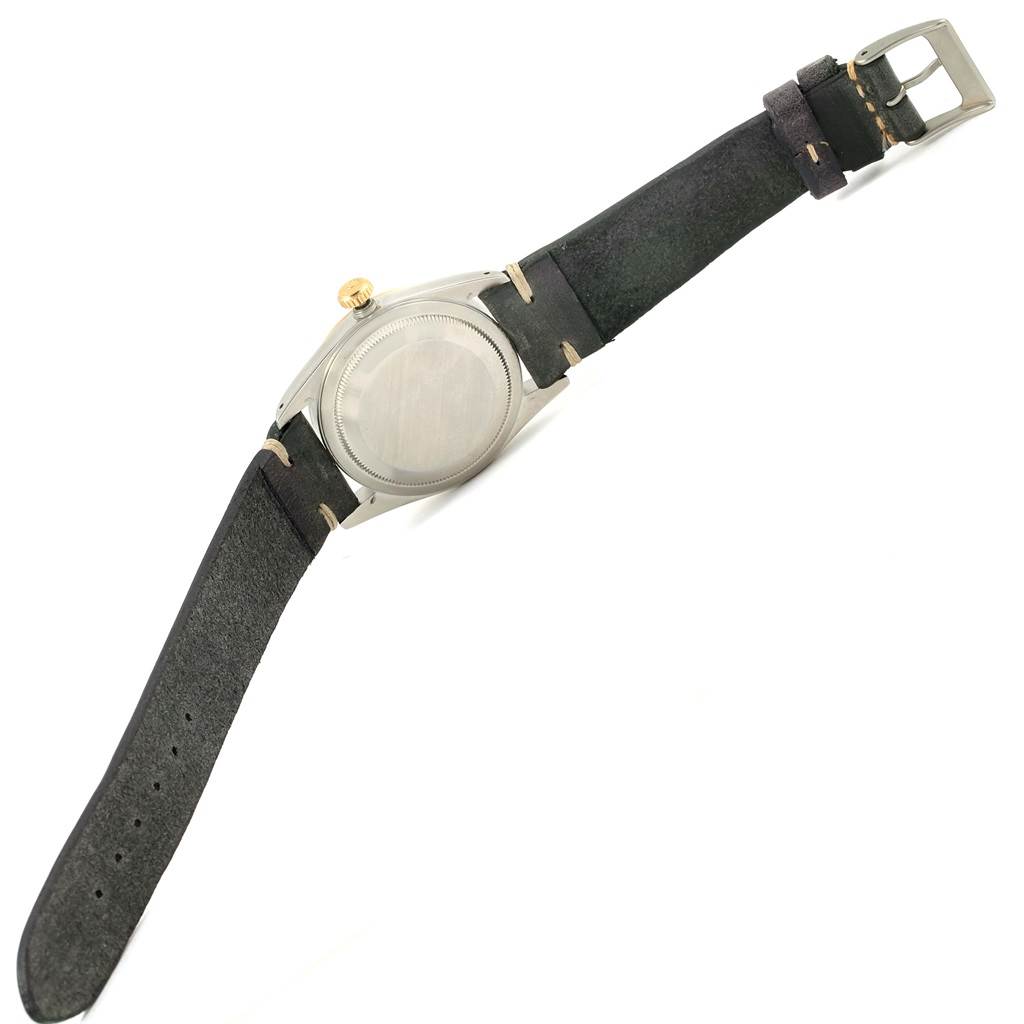 The image shows the back view of a Rolex Datejust 16233 Men's Steel and Gold (two tone) Champagne Dial 16233 Men's Steel and Gold (two tone) Champagne Dial model watch, highlighting the case back, crown, and leather strap.