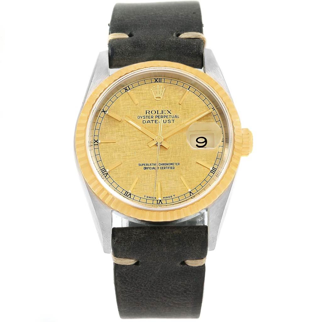 This image shows a front view of a Rolex Datejust 16233 Men's Steel and Gold (two tone) Champagne Dial 16233 Men's Steel and Gold (two tone) Champagne Dial watch with a gold dial and black leather strap.